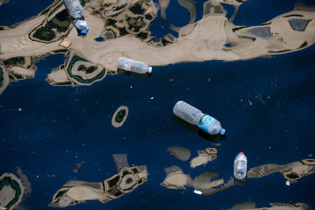 Plastic Bottles and Oil in Water Plastic Bottles and Oil in Water